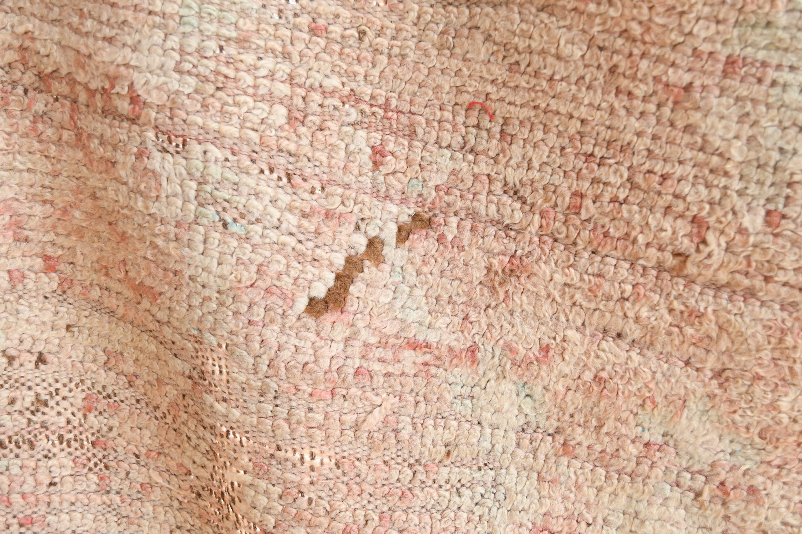 a close up of a pink and white moroccan rug. il_fullxfull.6065554381_9gwp.jpg