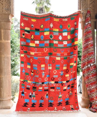 a red and black moroccan rug hanging on a wall. il_fullxfull.6065561605_i4x1.jpg