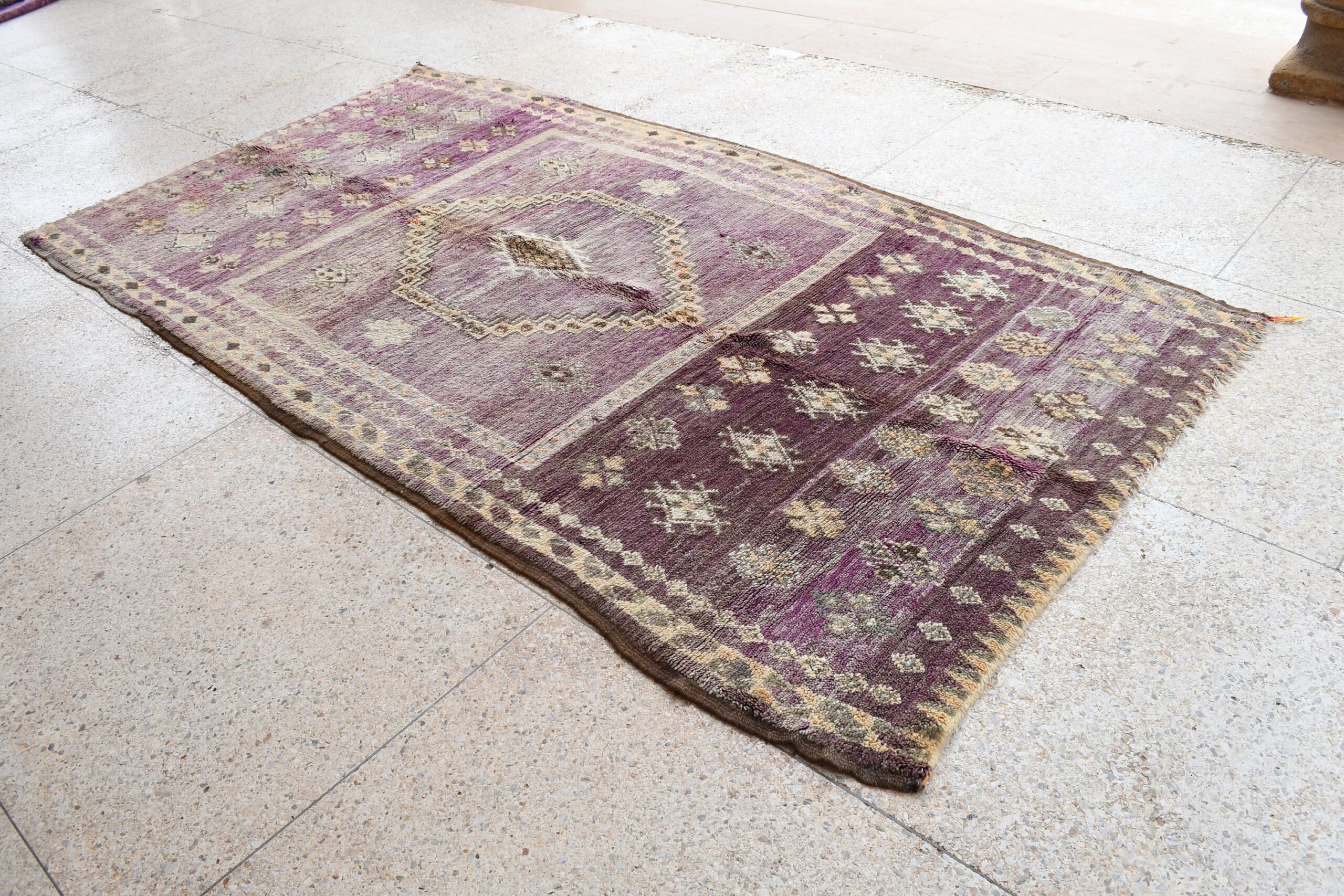 a purple rug with a pattern on it. il_fullxfull.6065564483_qty6.jpg