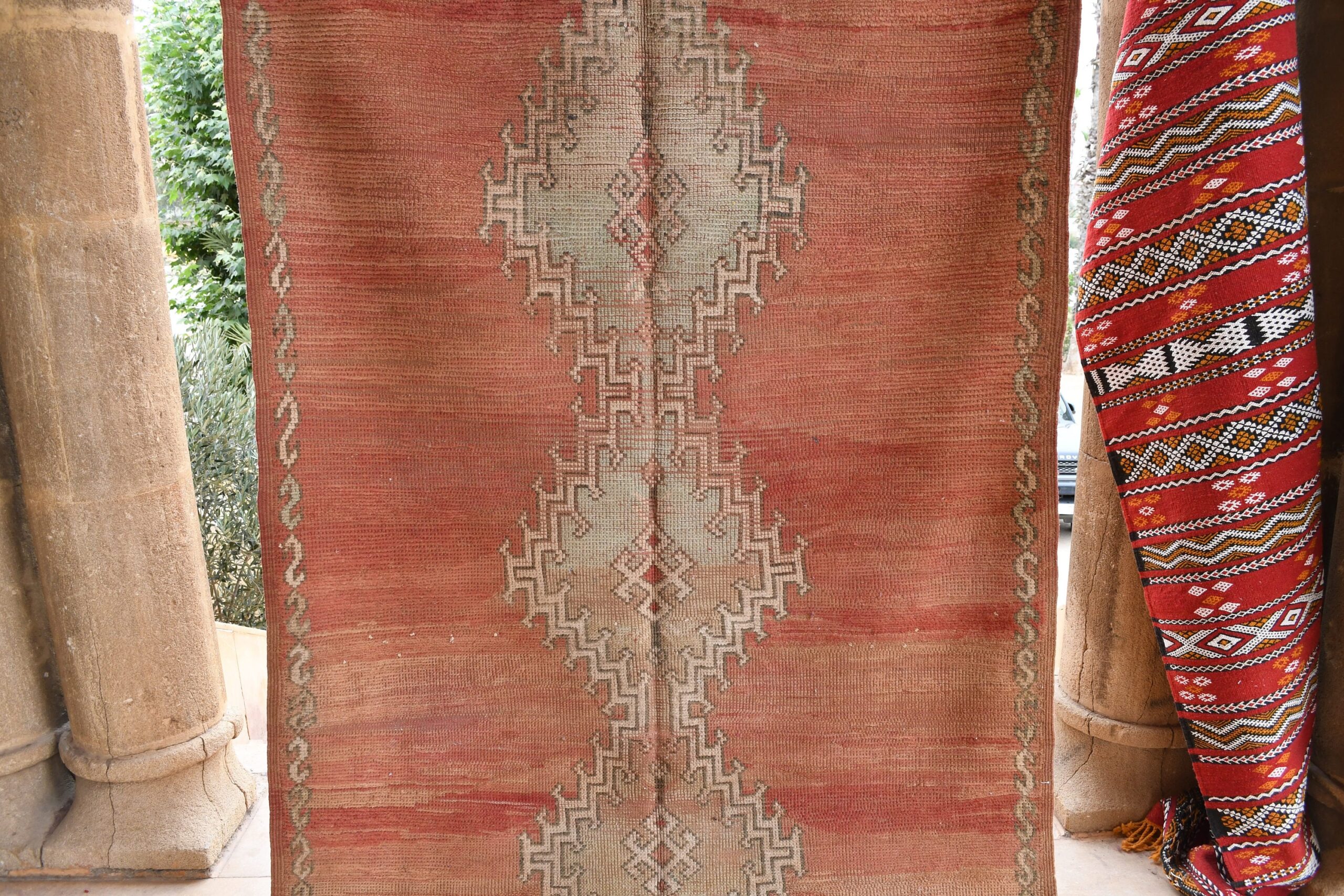 a red and beige rug with a pattern on it. il_fullxfull.6065565211_3hmn.jpg