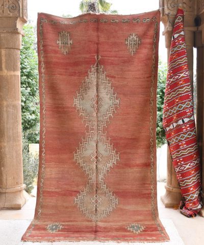 a red rug hanging on a wall. il_fullxfull.6065565377_ptge.jpg