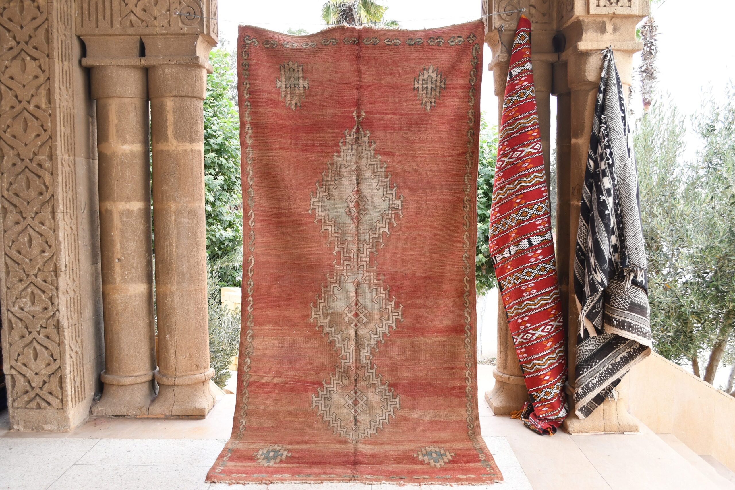 a red rug hanging on a wall. il_fullxfull.6065565377_ptge.jpg