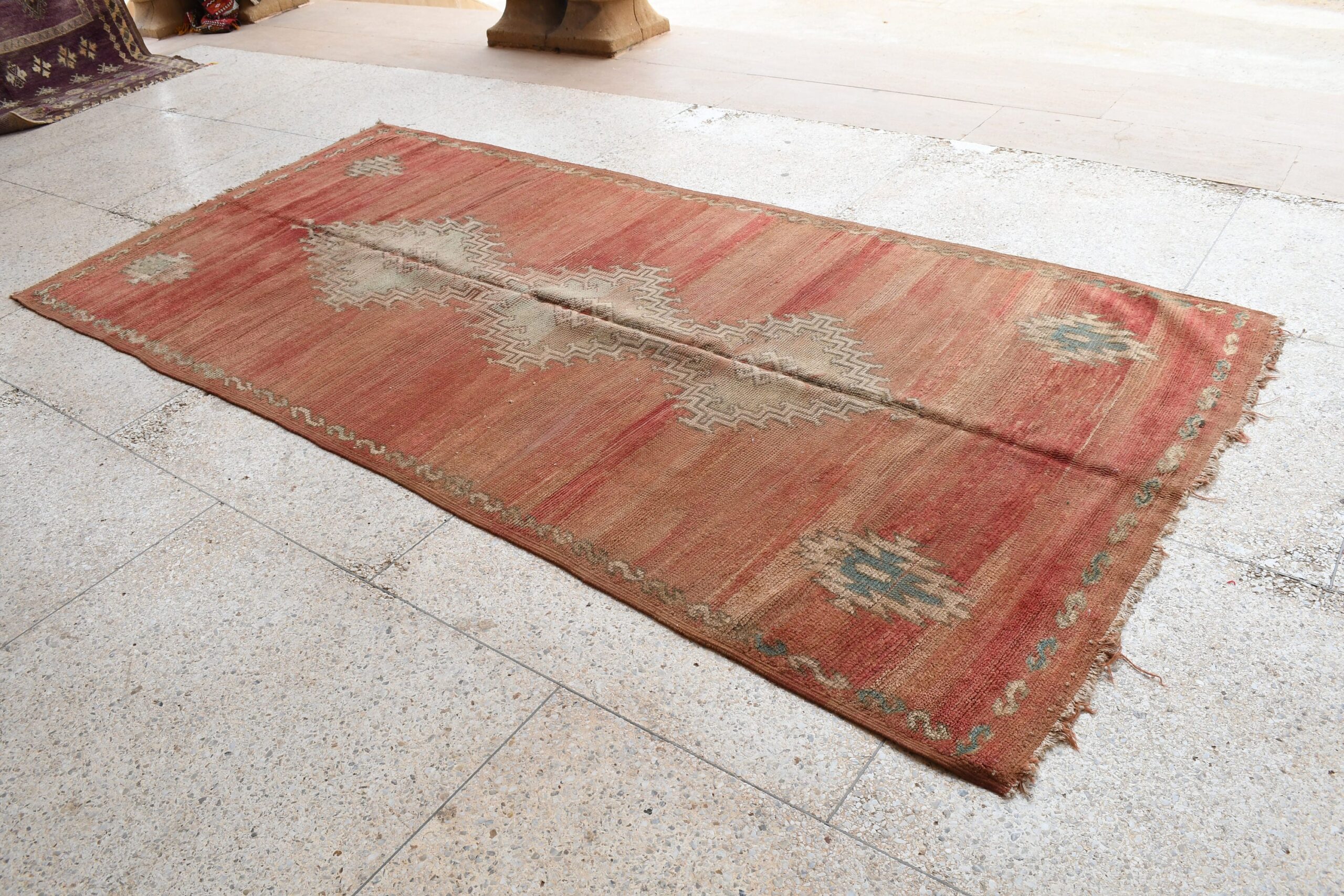 a red rug with a pattern on it. il_fullxfull.6065565579_aip9.jpg