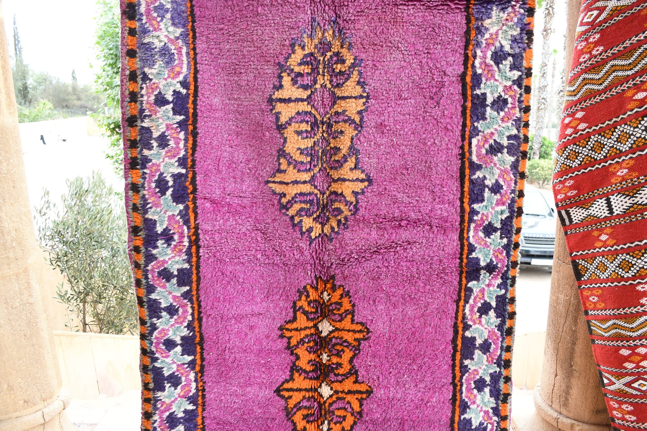 a purple rug with a pattern on it. il_fullxfull.6065566225_eldl.jpg