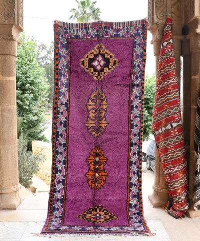 a purple rug with a floral design on it. il_fullxfull.6065566539_66uc.jpg