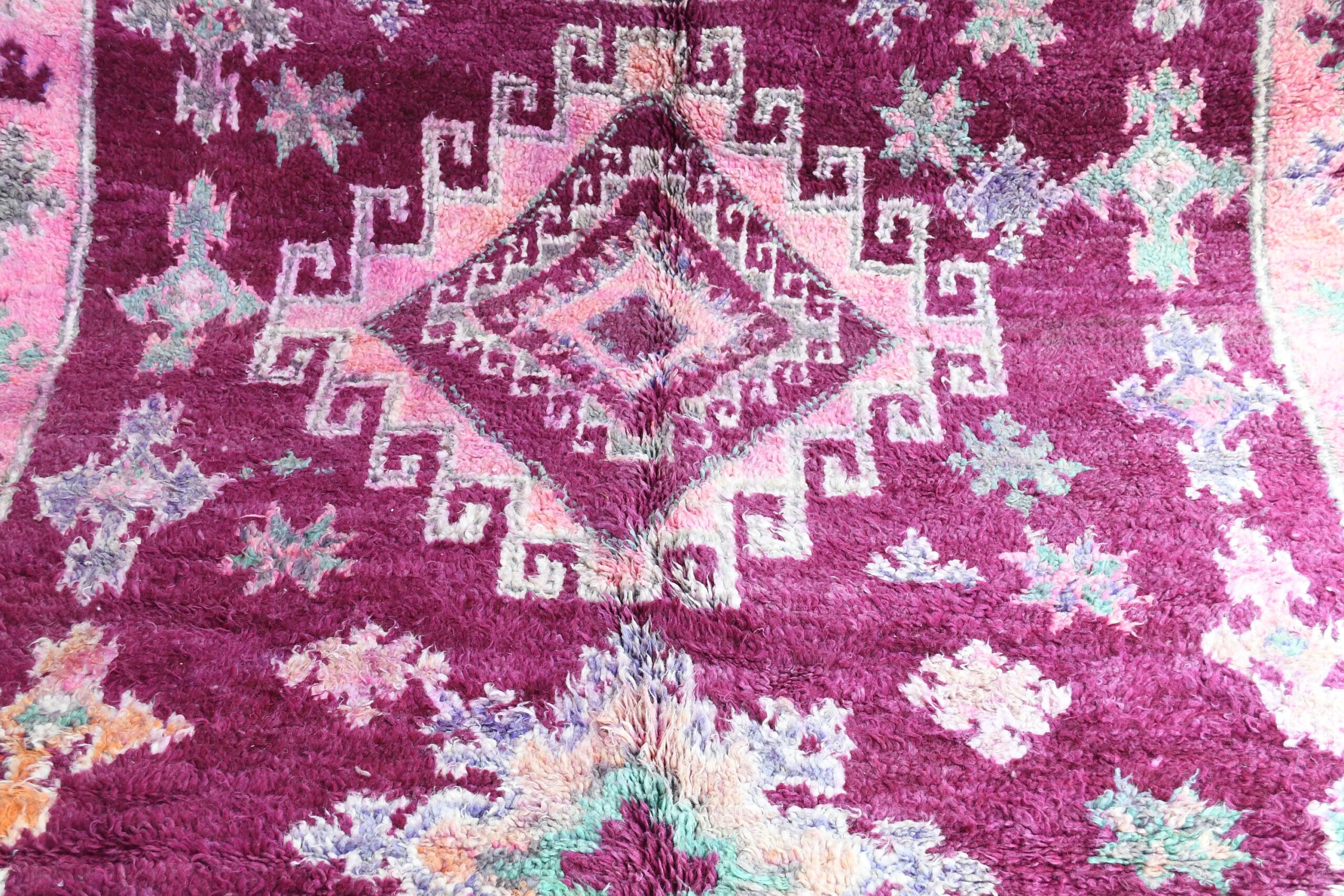 a purple rug with a floral design on it. il_fullxfull.6065568285_4kmz.jpg