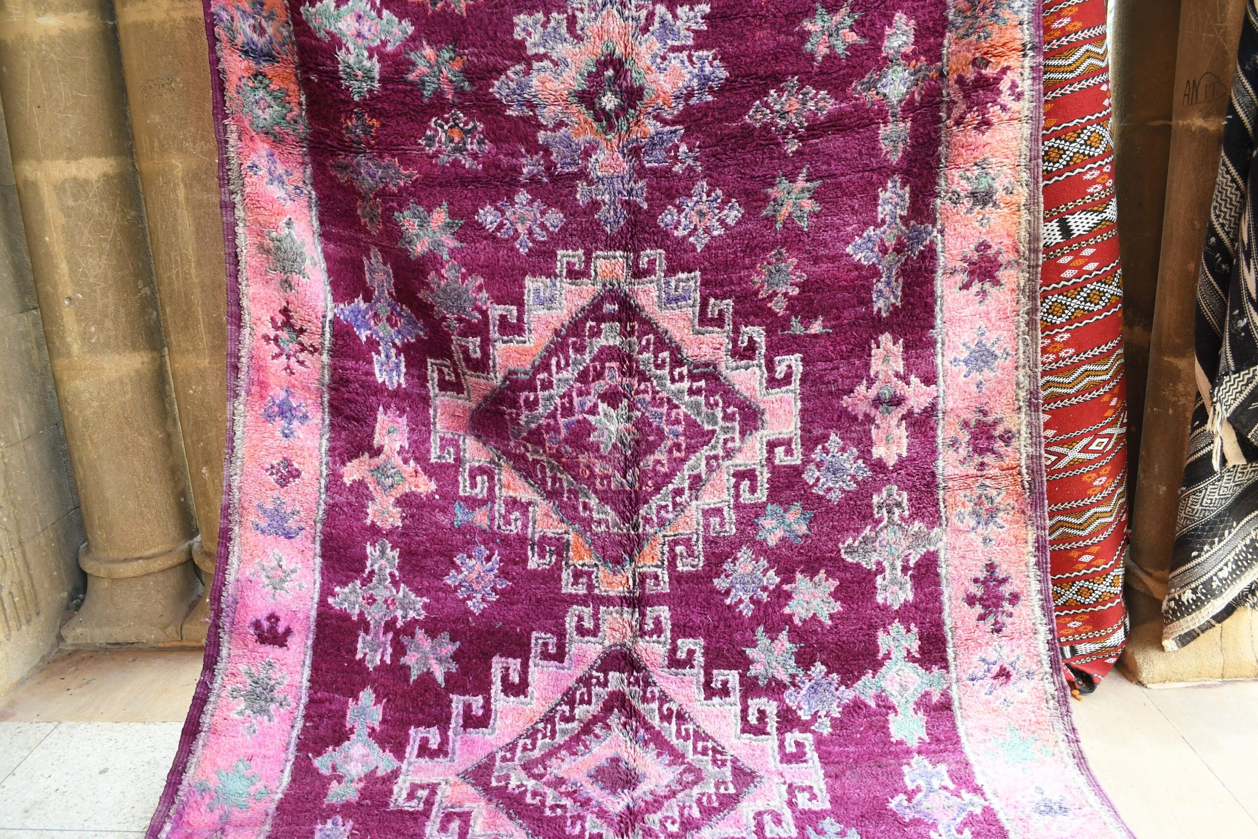 a purple and pink rug with a floral design. il_fullxfull.6065568587_77b0.jpg