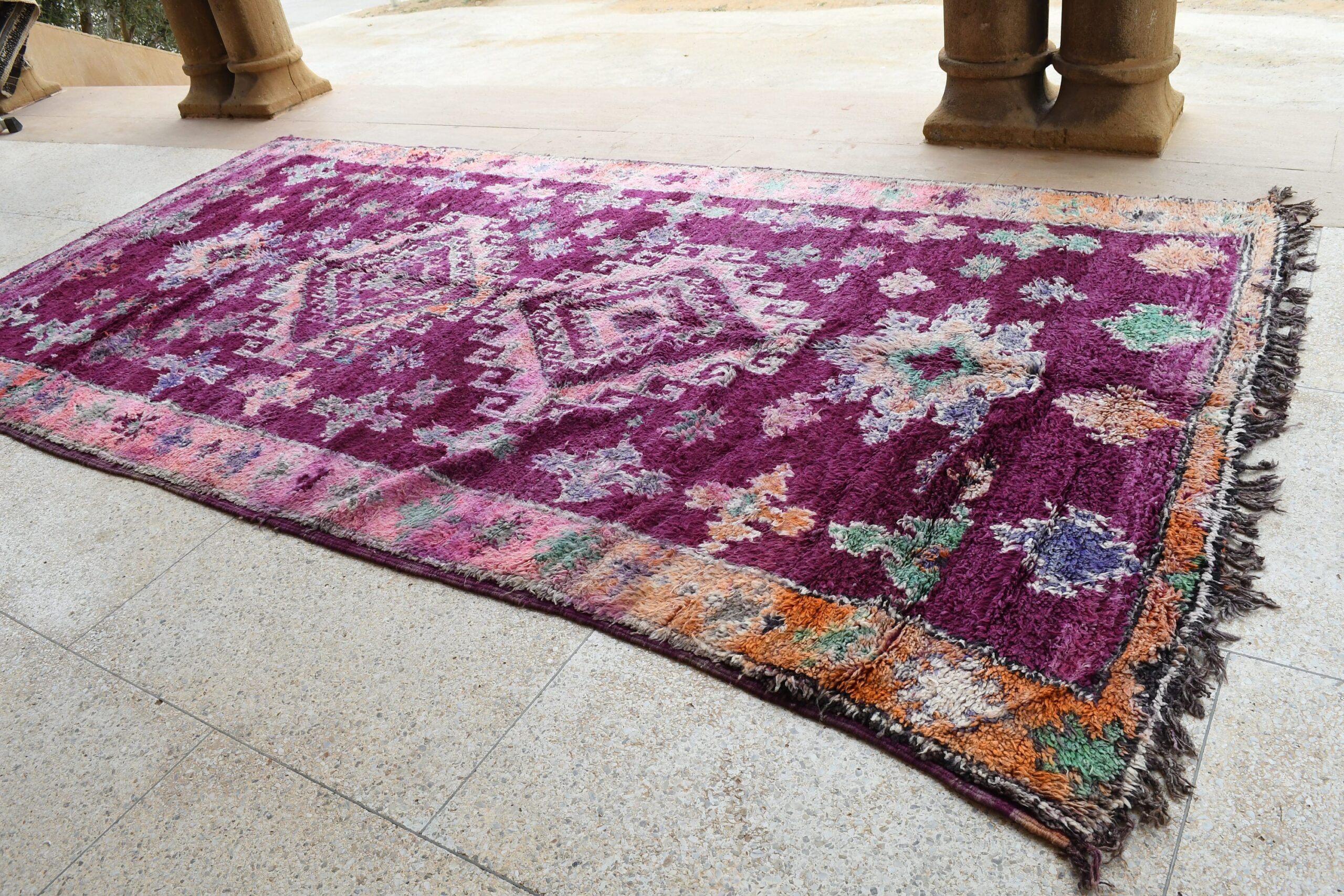 a purple rug with a floral design on it. il_fullxfull.6065568947_rlxp.jpg