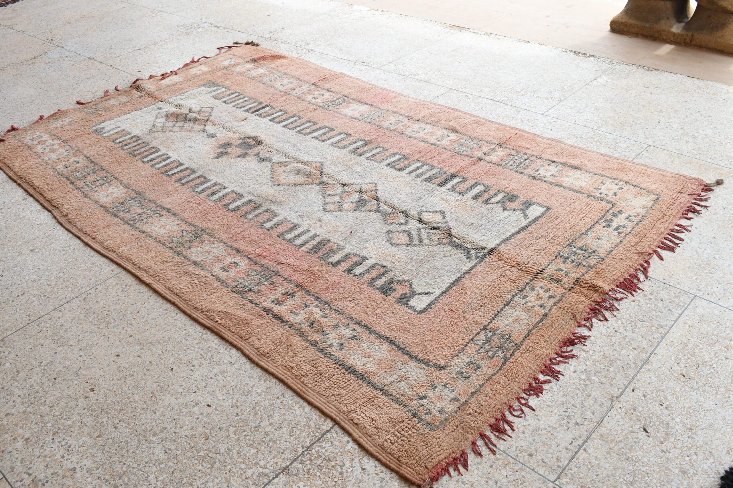 a rug with a red and white design on it. il_fullxfull.6065569893_2uv1.jpg