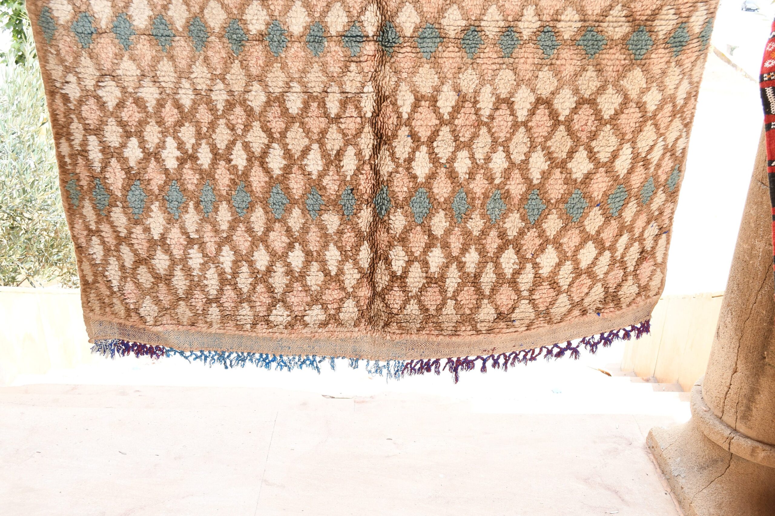 a rug hanging on a wall. il_fullxfull.6065570385_r4pr.jpg