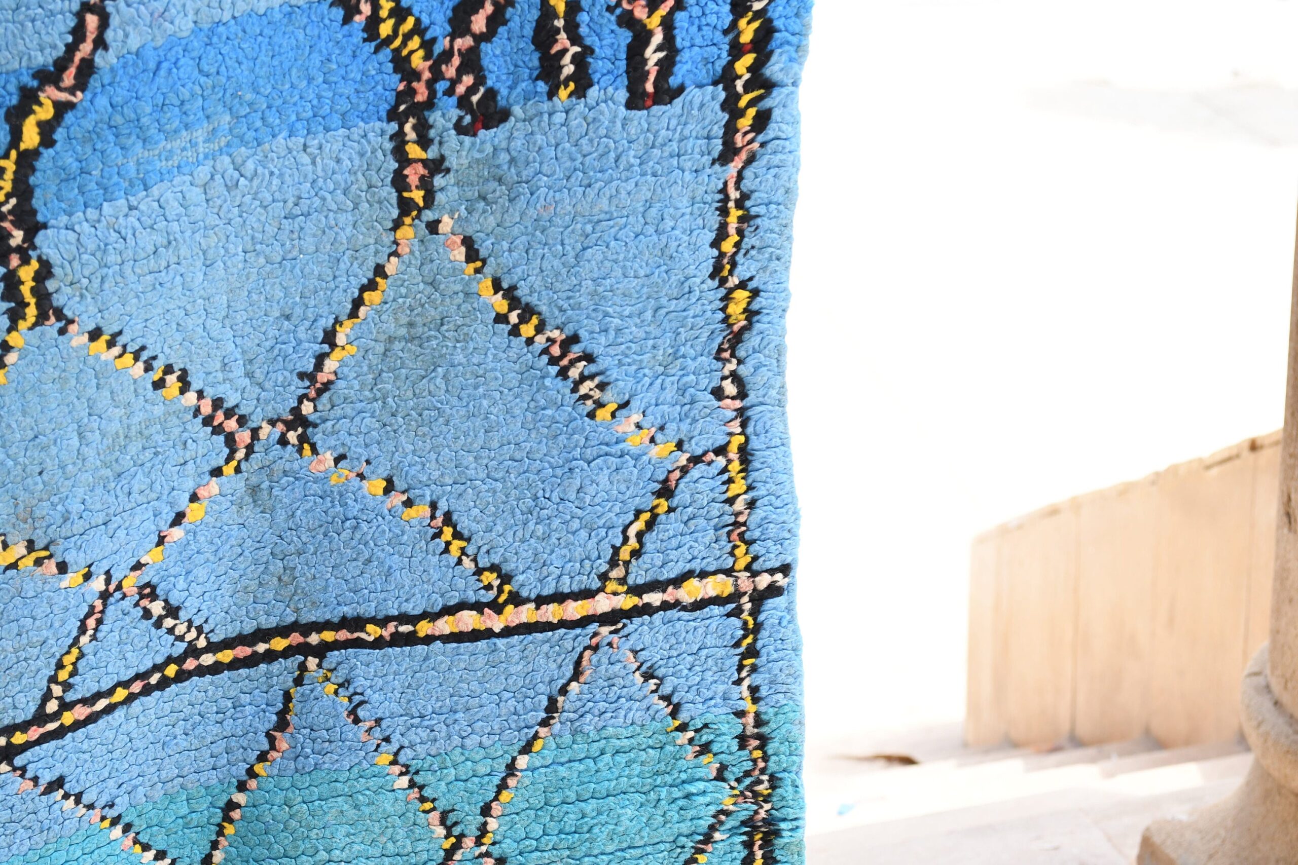 a blue rug with a pattern on it. il_fullxfull.6065573869_c282.jpg