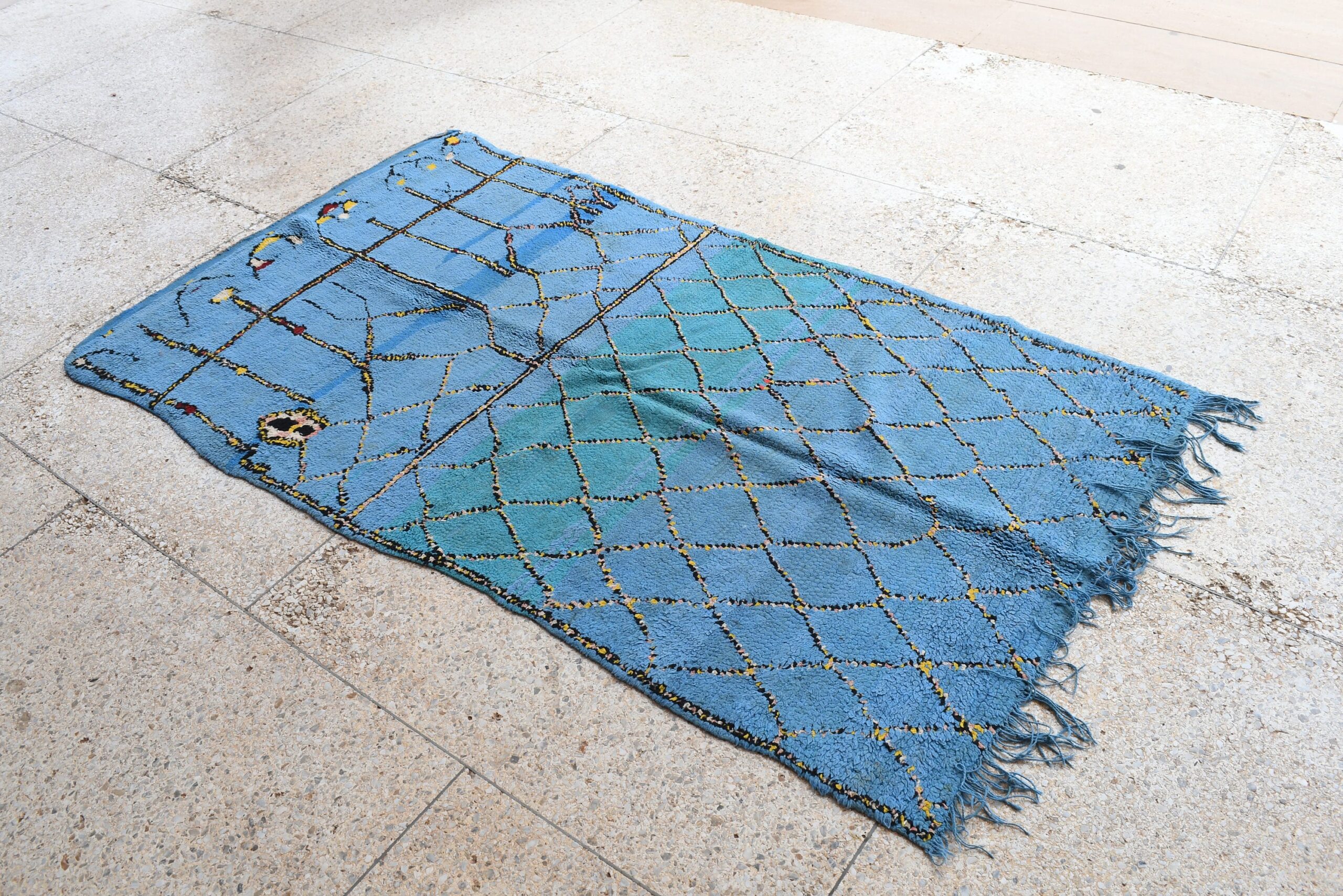 a blue rug with a pattern on it. il_fullxfull.6065574937_nb6v.jpg