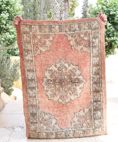 a woman standing next to a rug on a sidewalk. il_fullxfull.6065575881_zl1r.jpg