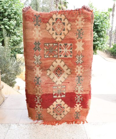a red rug with a pattern on it. il_fullxfull.6065576947_2d7i.jpg