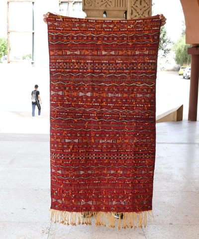 a red rug hanging on a wall. il_fullxfull.6065612529_1q3u.jpg