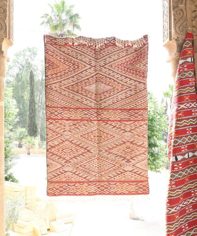 a red and white rug hanging from a doorway. il_fullxfull.6065621057_pm5q.jpg