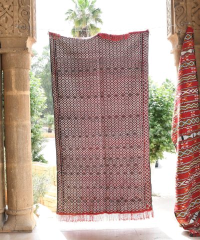 a red and white rug hanging from a doorway. il_fullxfull.6065622491_g05j.jpg