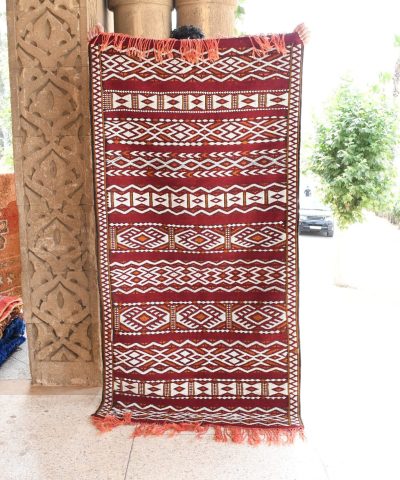 a red and white rug. il_fullxfull.6065628379_r0fr.jpg