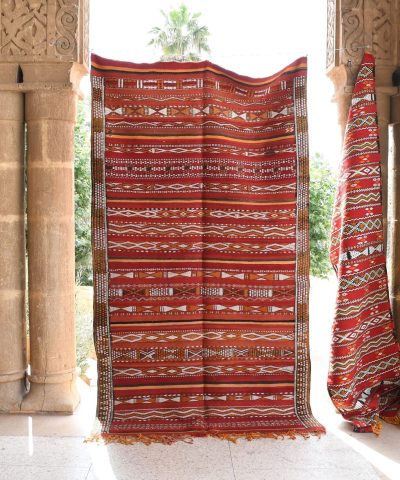 a red and white rug hanging from a doorway. il_fullxfull.6065630057_ic9w.jpg