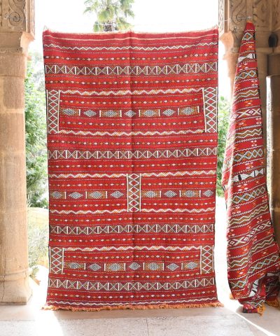 a red and white rug hanging on a wall. il_fullxfull.6065635507_a60p.jpg