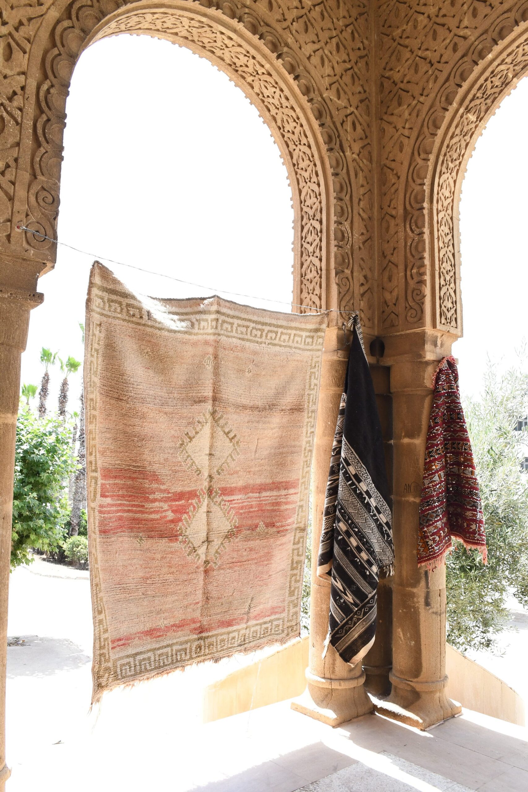 a woman is standing in a doorway with a rug. il_fullxfull.6069336853_qmlt.jpg