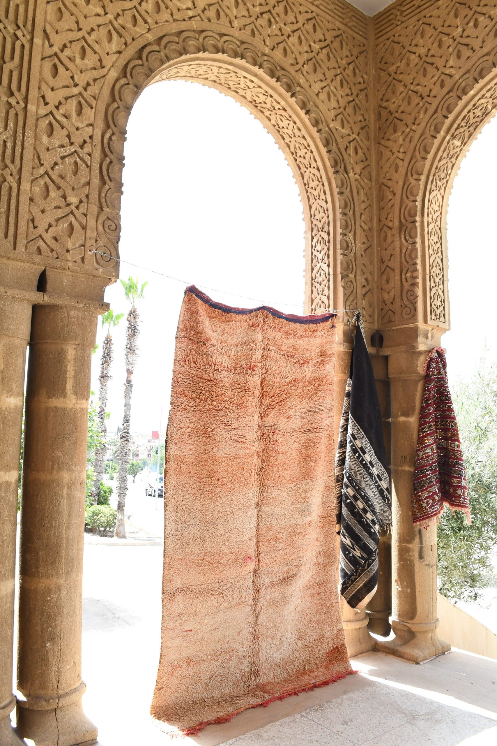 a woman is standing in a building with a large rug. il_fullxfull.6069357465_jl0w.jpg