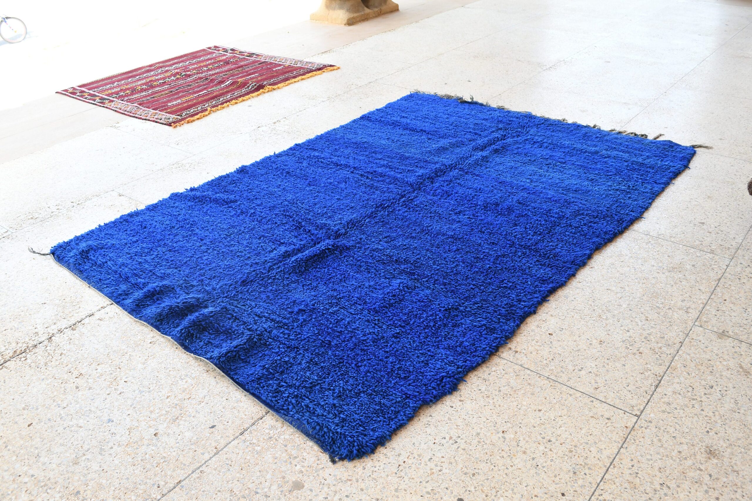 a blue rug on the floor. il_fullxfull.6069414423_rixv.jpg