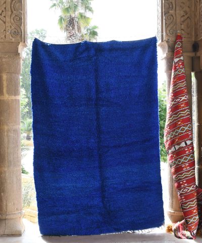 a blue towel hanging on a wall. il_fullxfull.6069414433_5tx2.jpg