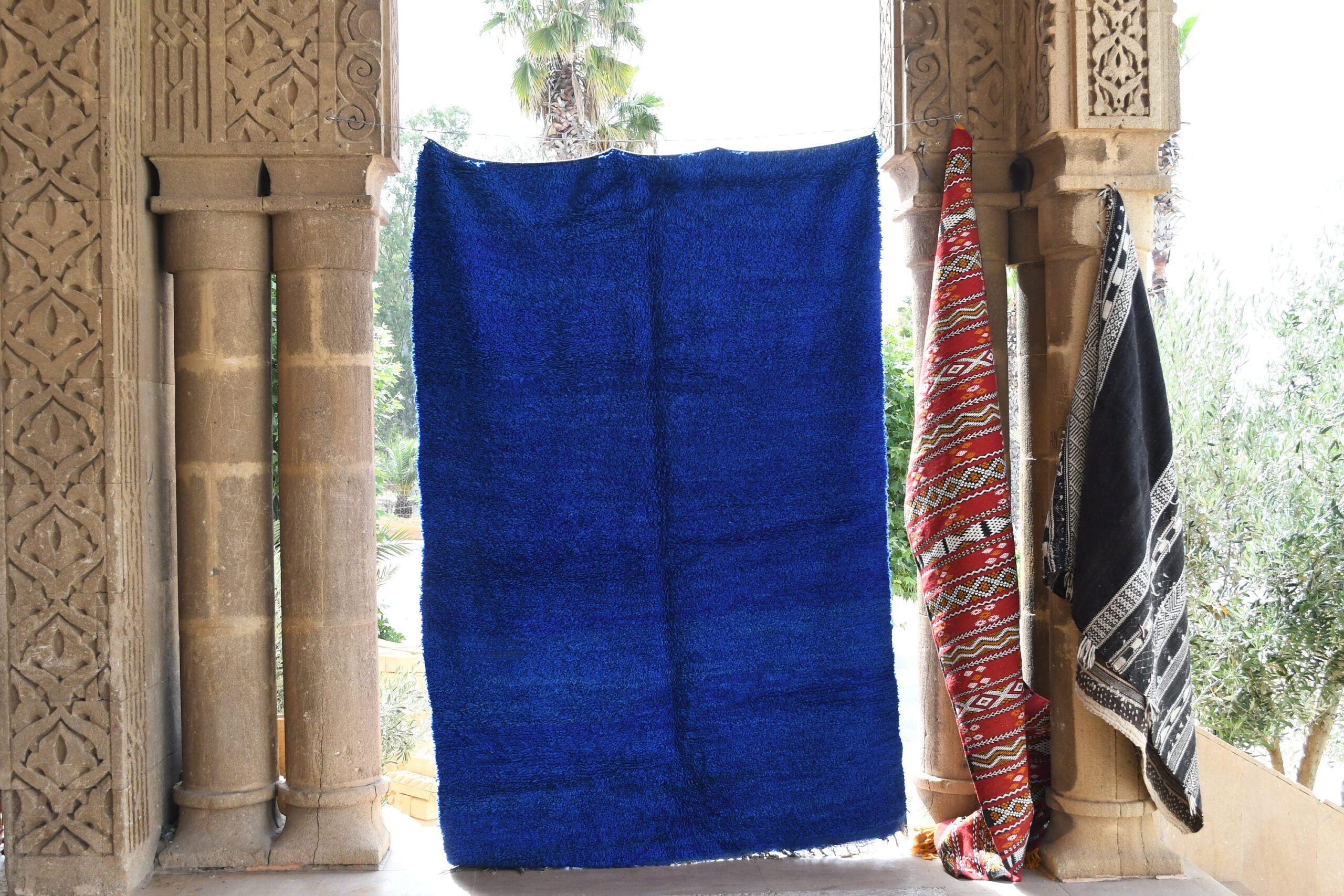 a blue towel hanging on a wall. il_fullxfull.6069414433_5tx2.jpg