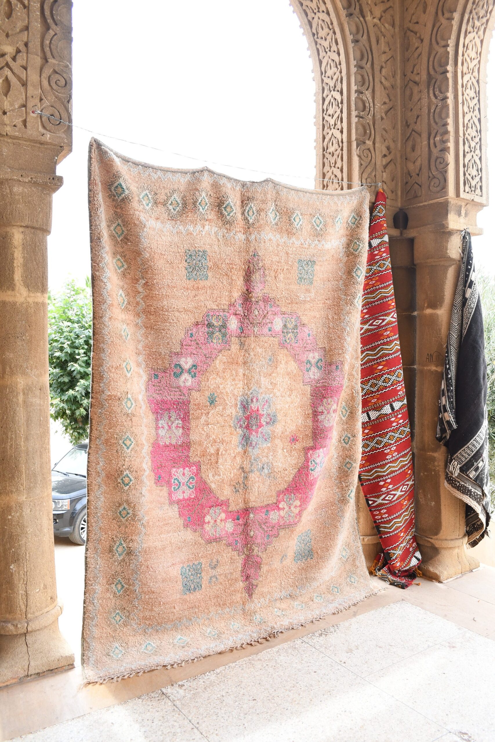 a rug hanging on a wall in a building. il_fullxfull.6071146255_922x.jpg