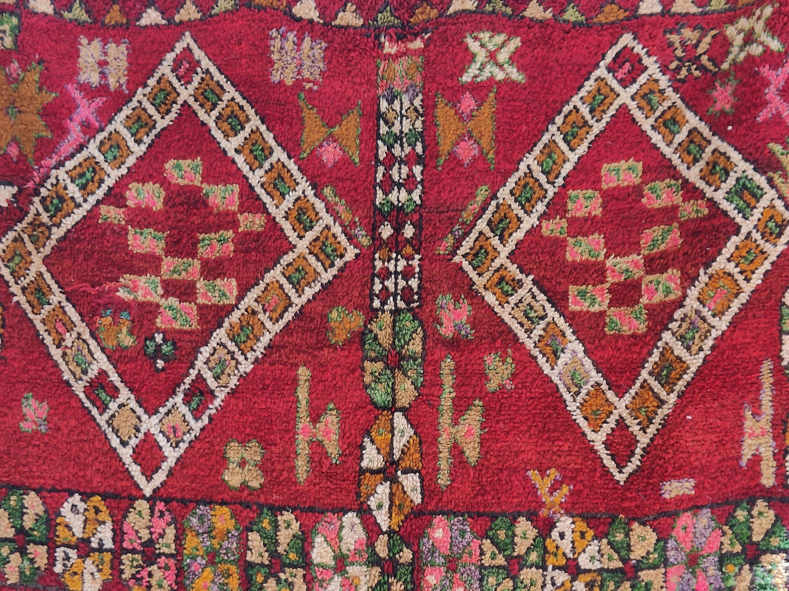 a red rug with a pattern on it. il_fullxfull.6071167139_eta0.jpg