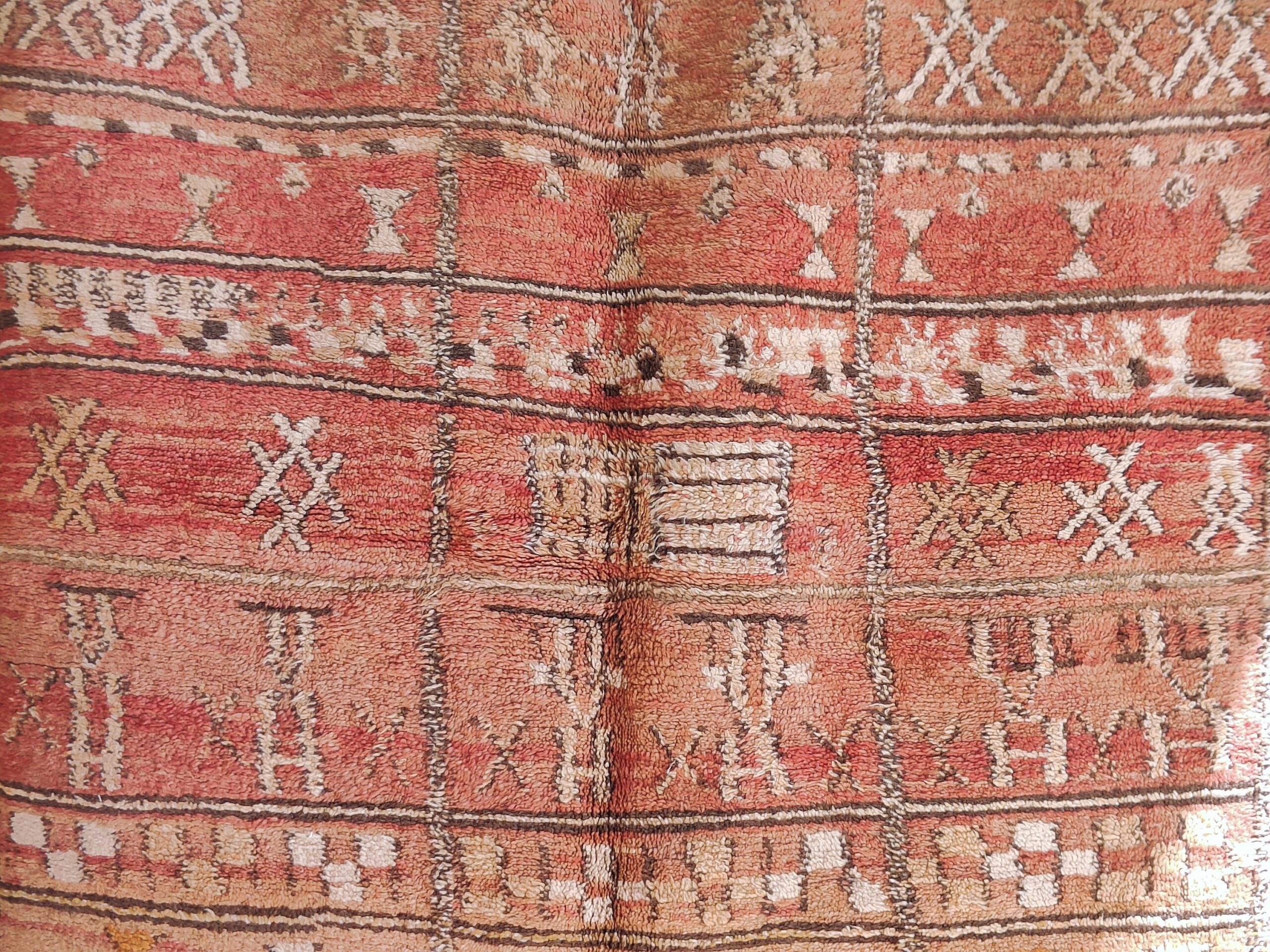 a red and brown rug with a pattern. il_fullxfull.6071178373_bi8g.jpg