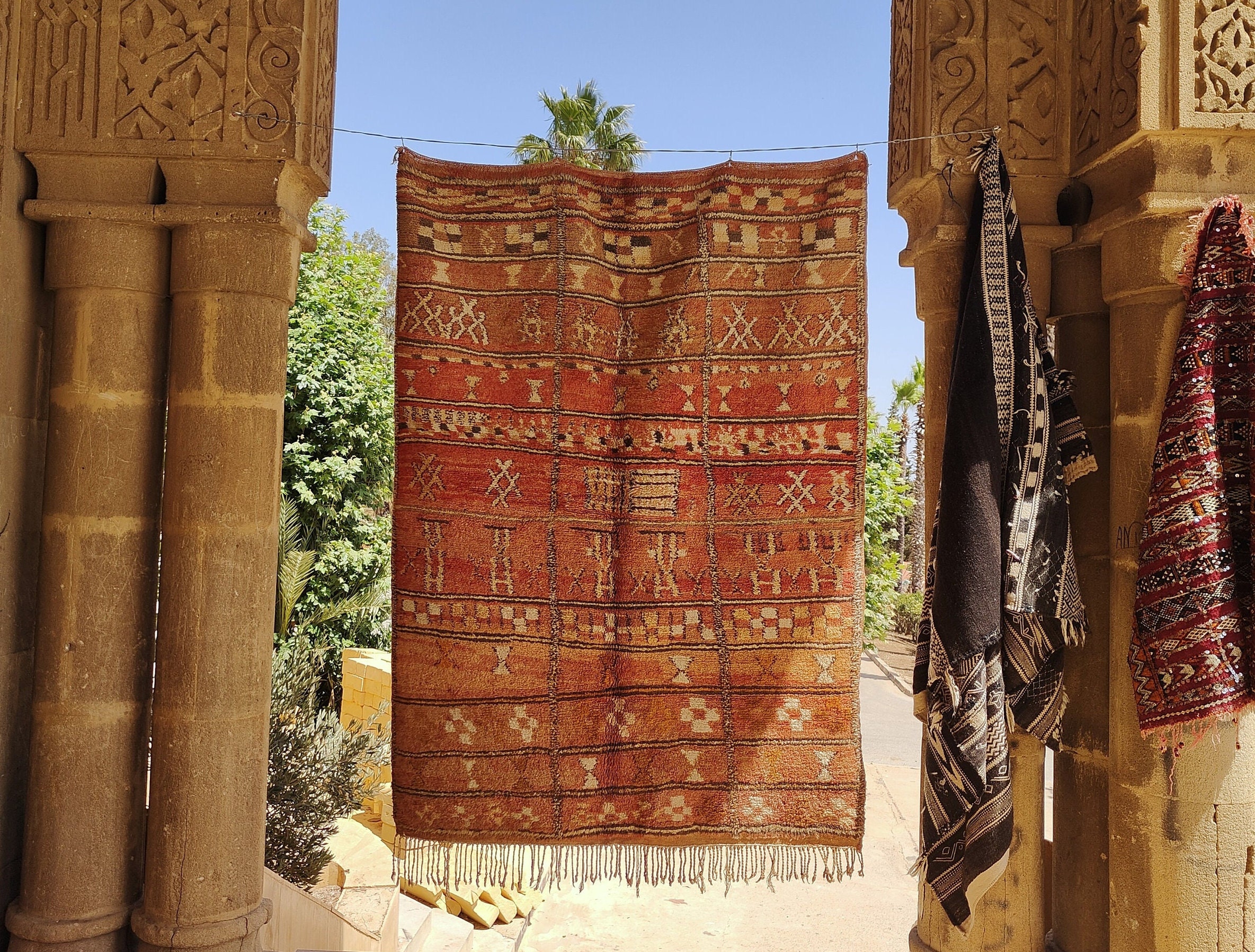 a red rug hanging on a wall. il_fullxfull.6071180991_r3oz.jpg