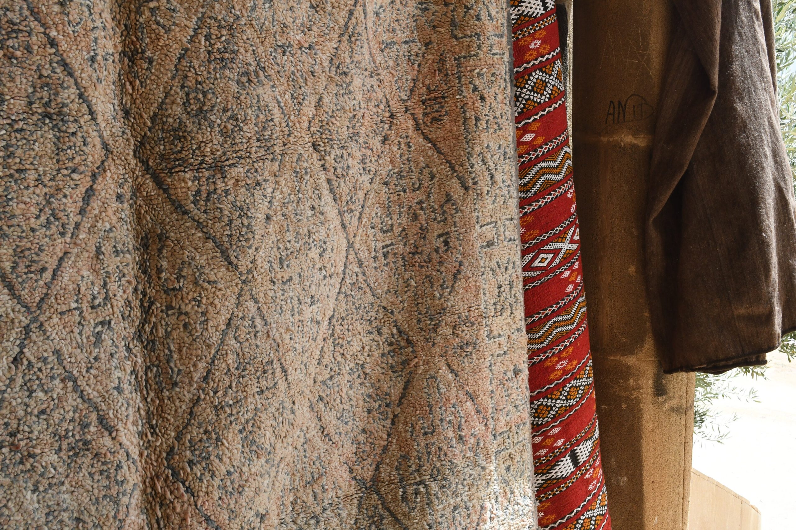 a brown coat hanging on a clothes rack. il_fullxfull.6073926253_48iu.jpg