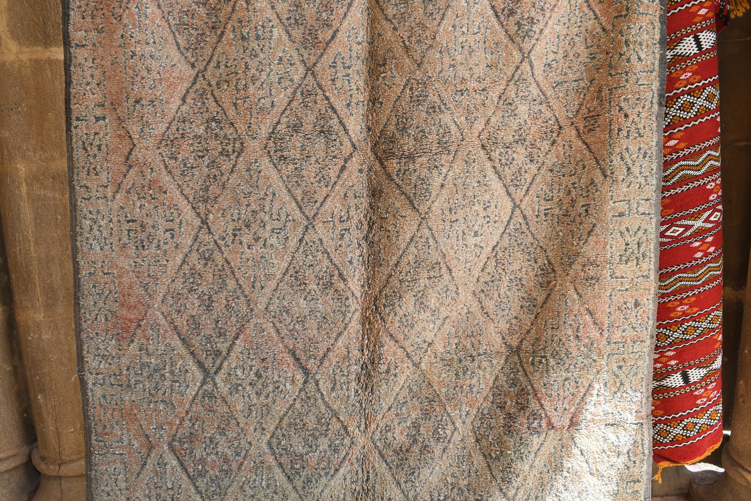 a rug is hanging on a wall. il_fullxfull.6073926533_475t.jpg