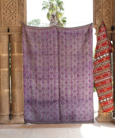 a purple and red moroccan rug hanging on a wall. il_fullxfull.6073930843_dy8m.jpg