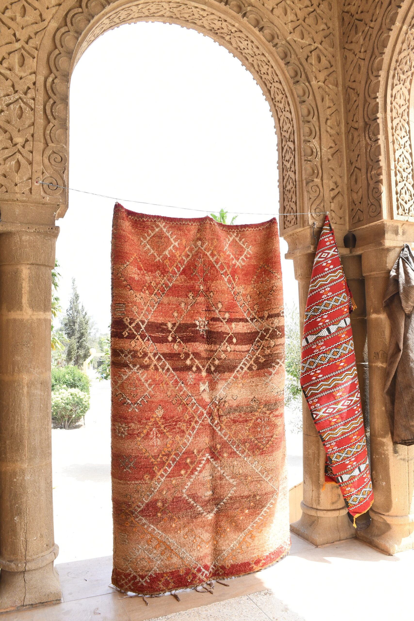 a red rug hanging on a wall. il_fullxfull.6073941971_fet4.jpg