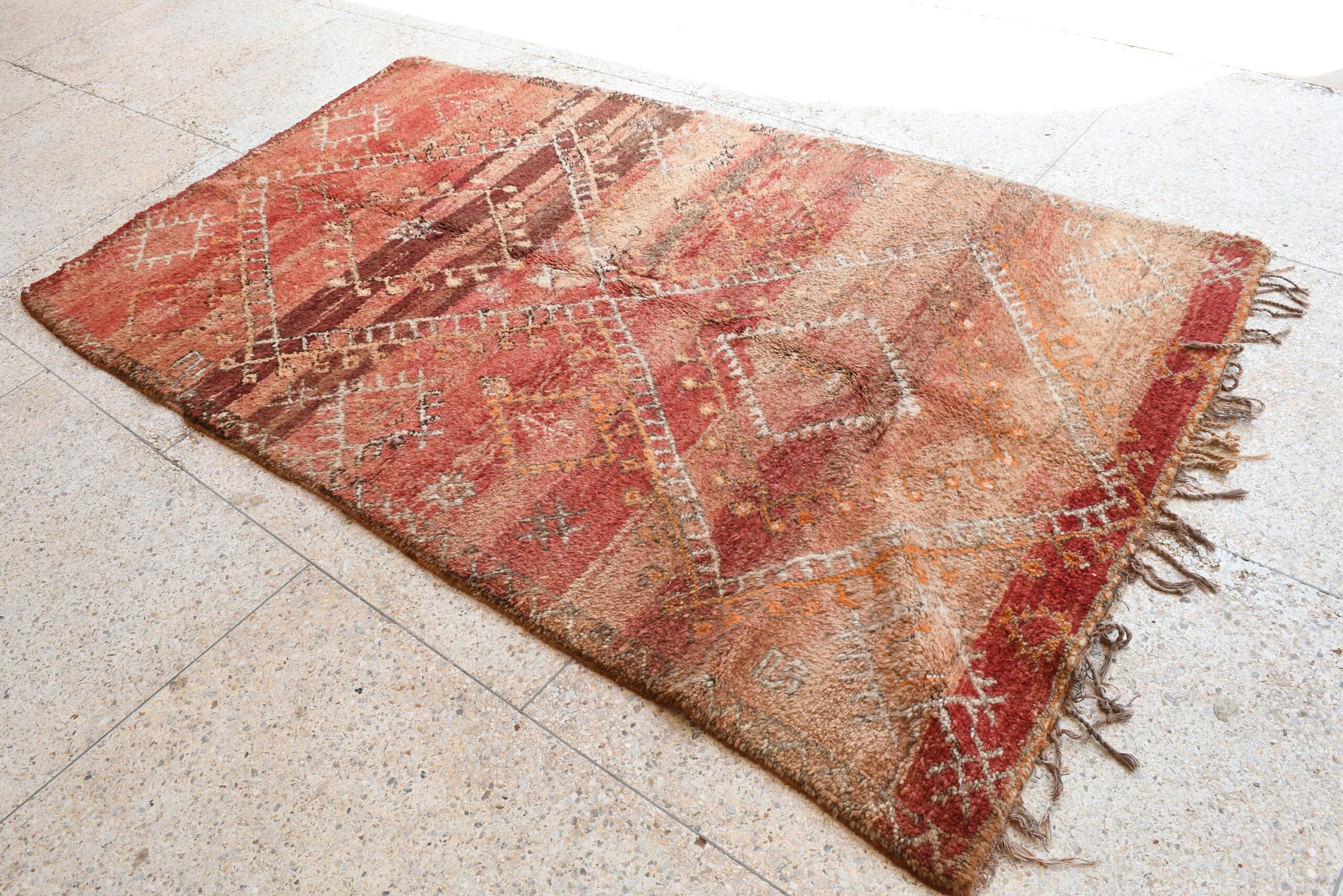 a red and beige rug with fringes. il_fullxfull.6073942149_pqqx.jpg