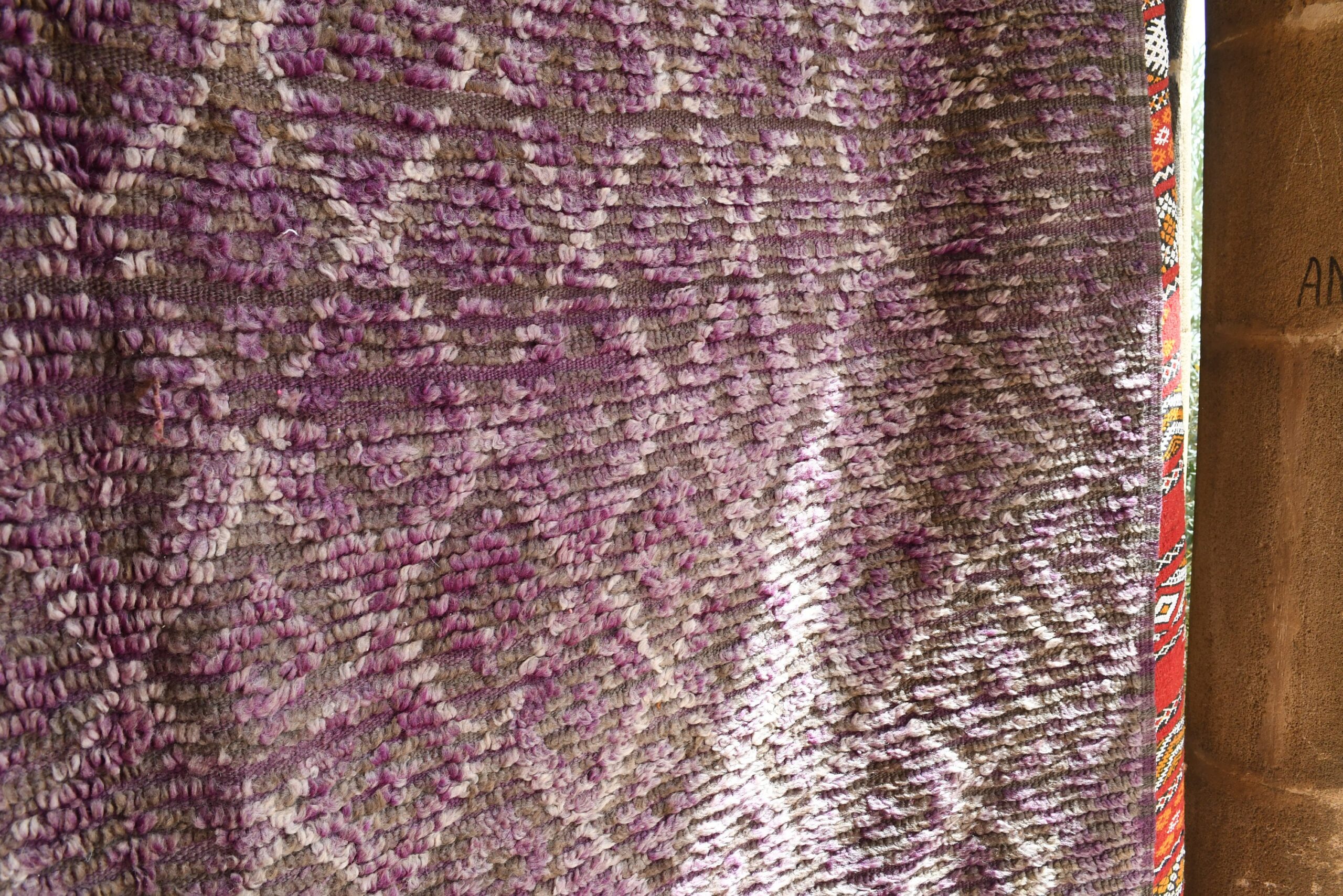 a purple rug hanging on a wall. il_fullxfull.6073956567_sfl0.jpg