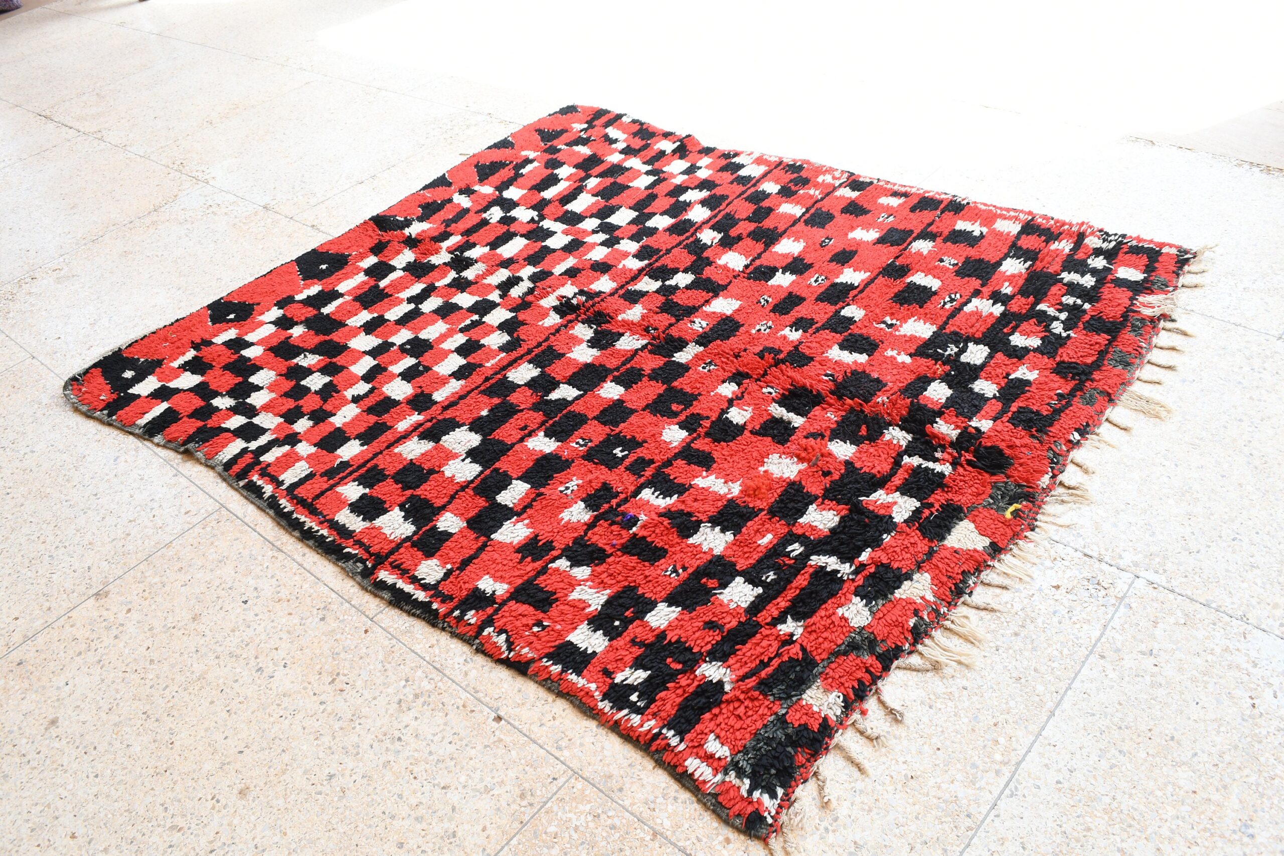 a red and black rug on the floor. il_fullxfull.6073975891_jzhk.jpg