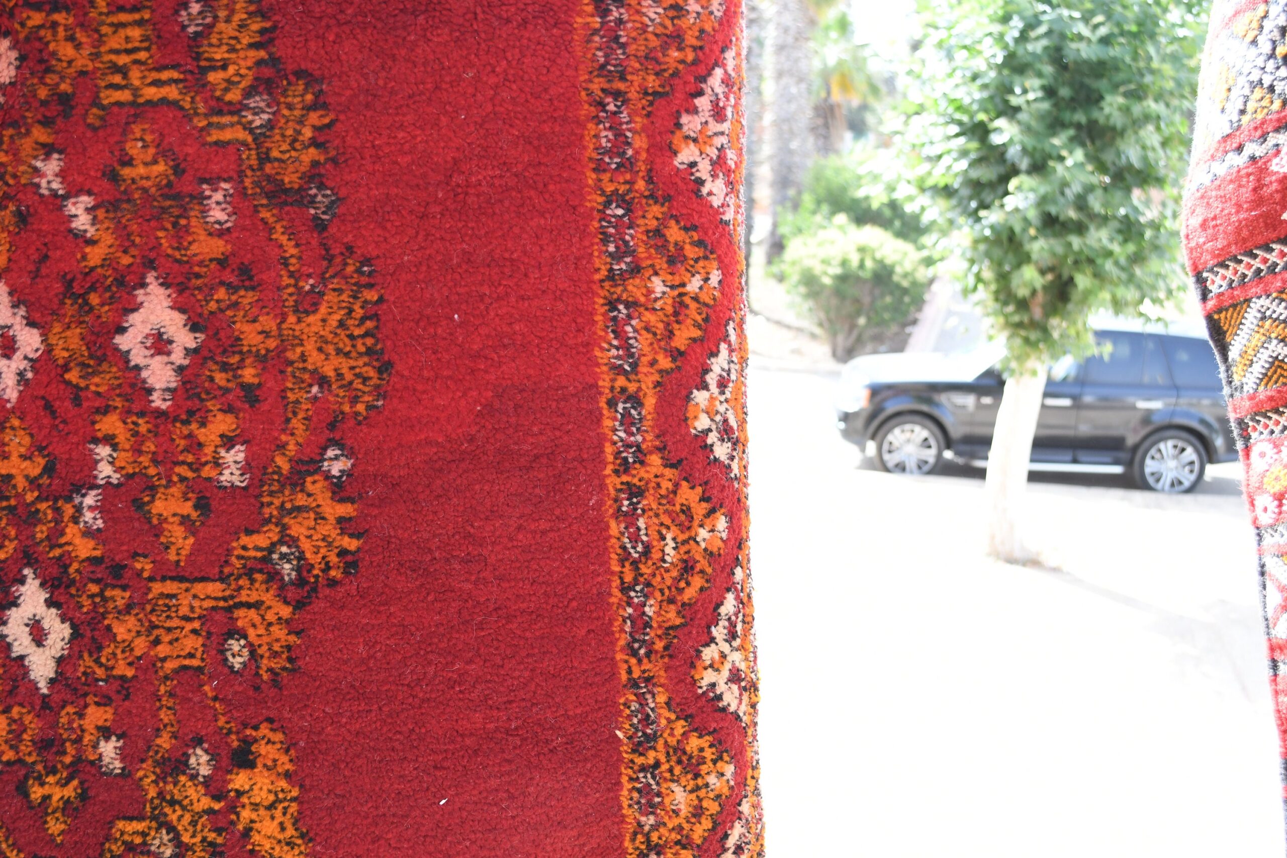 a red and orange rug. il_fullxfull.6076125423_mkw9.jpg