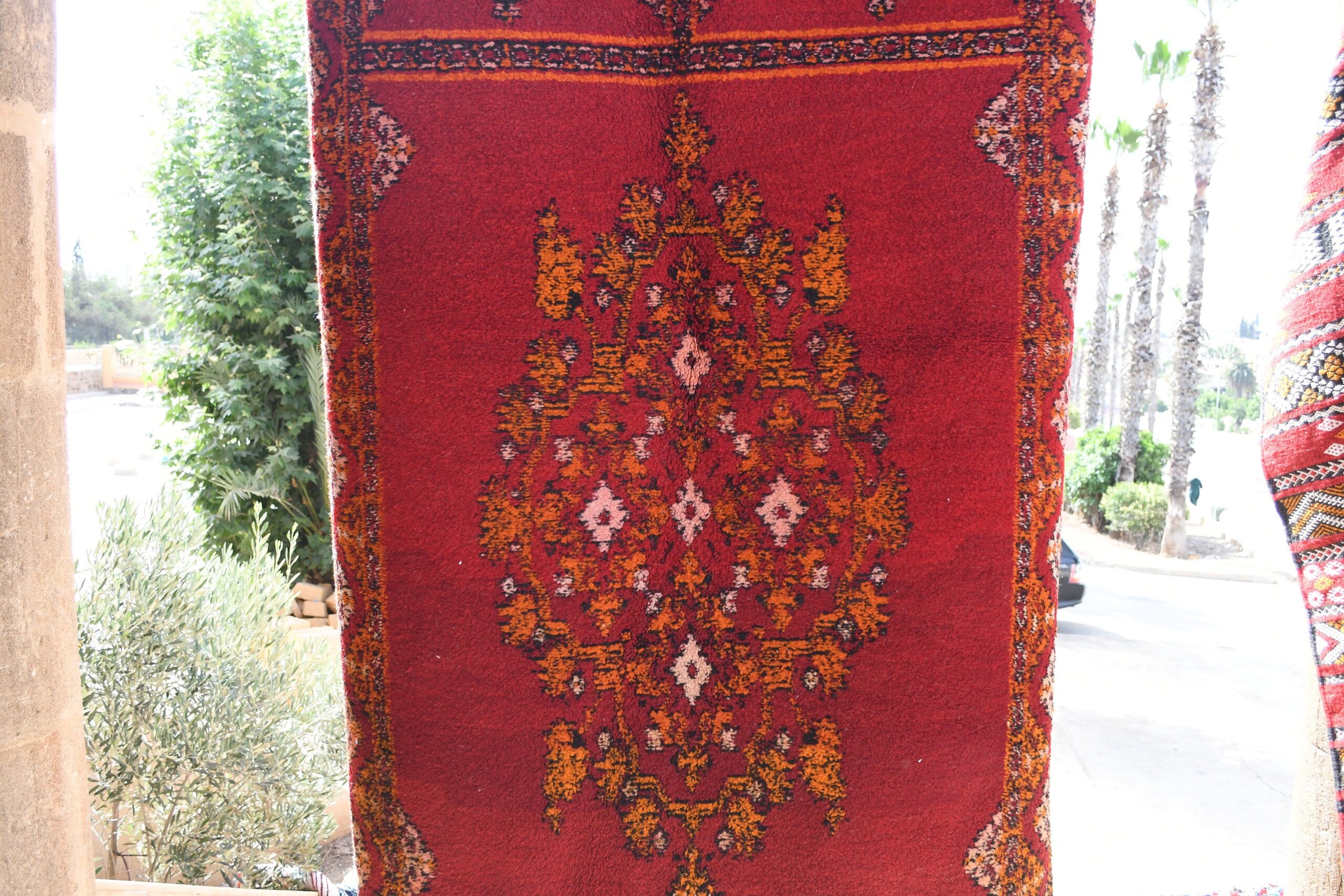 a red rug hanging on a wall. il_fullxfull.6076125645_r2tt.jpg