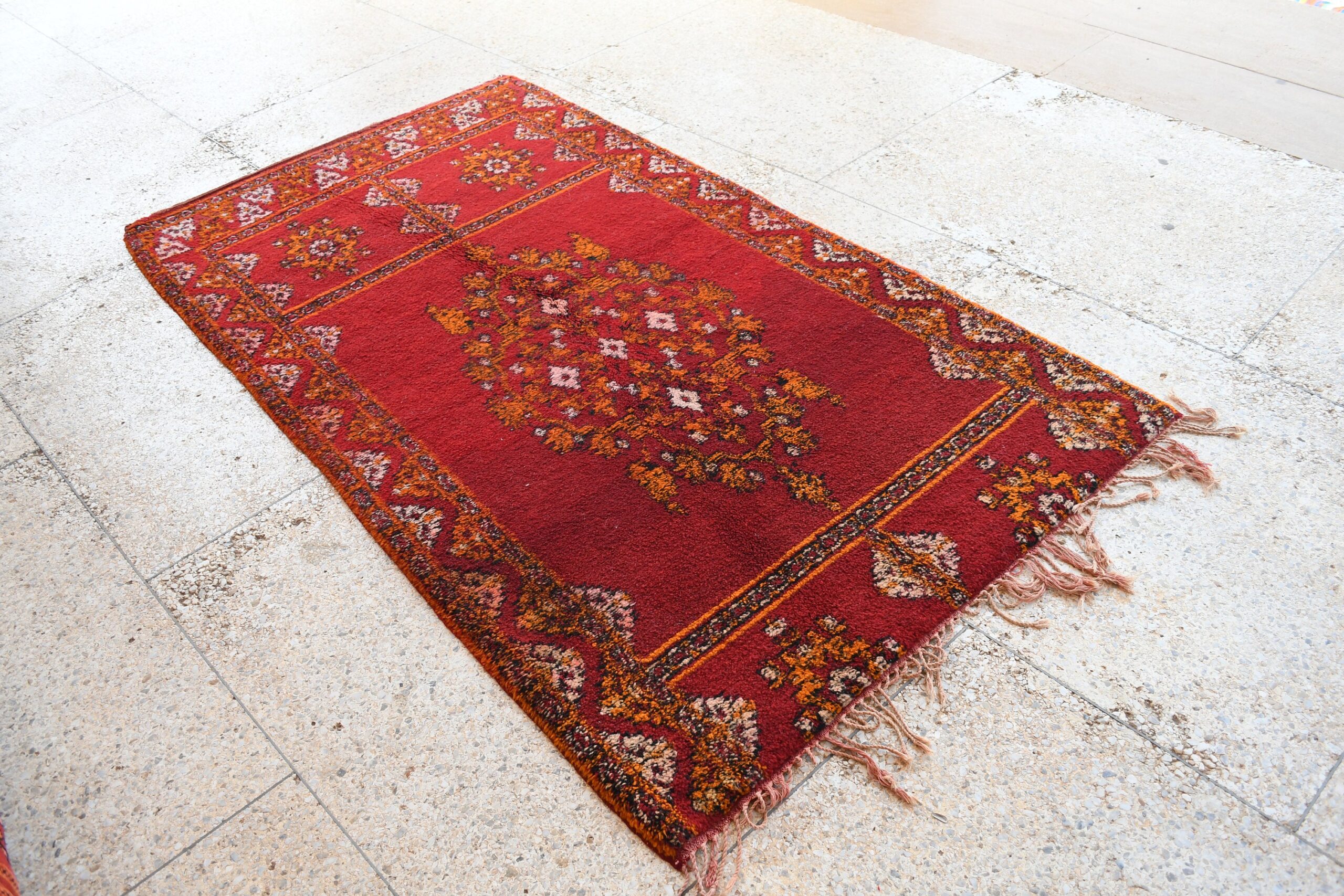 a red rug with a floral design on it. il_fullxfull.6076125761_jrzv.jpg