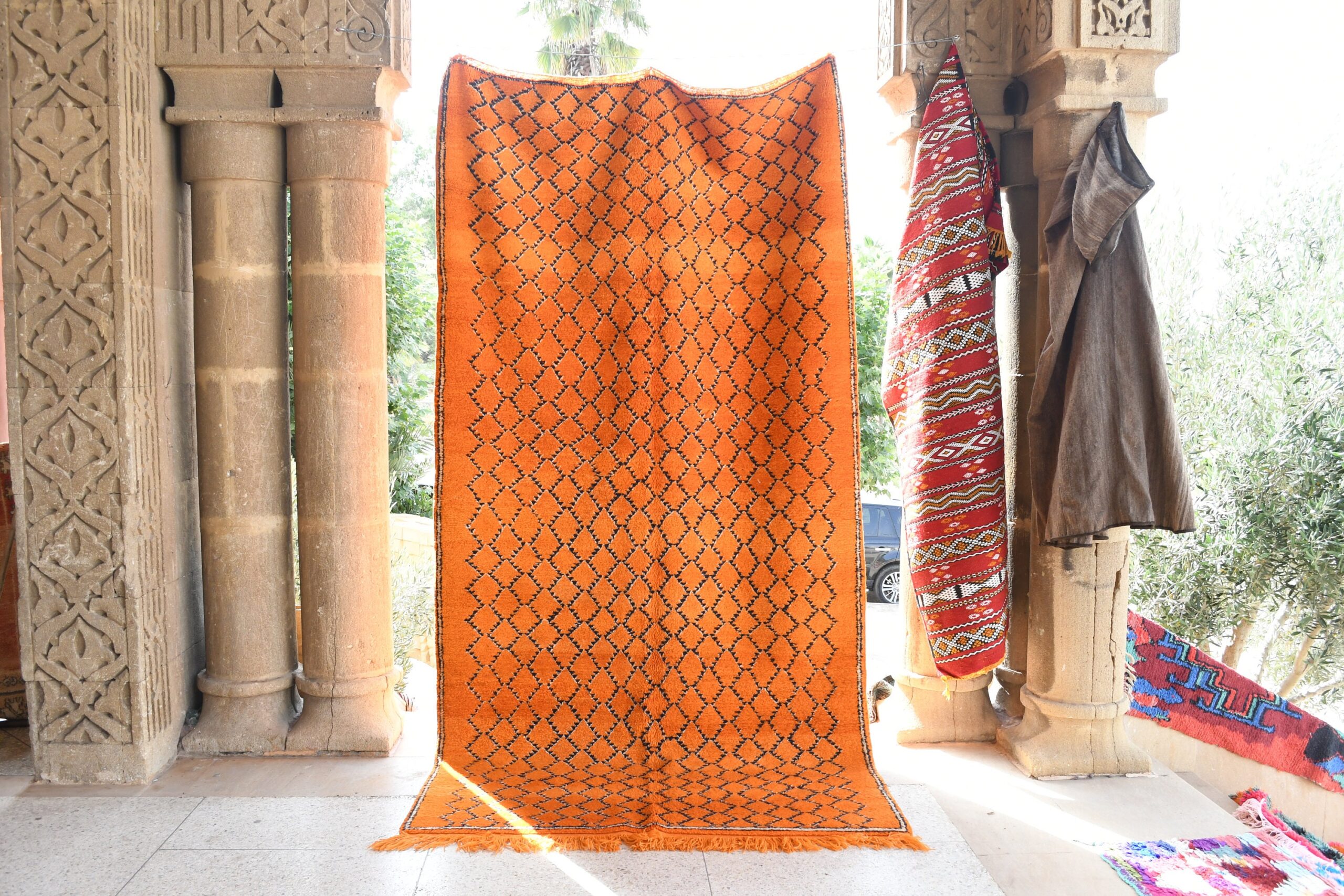 a large orange rug. il_fullxfull.6076128447_fyi5.jpg