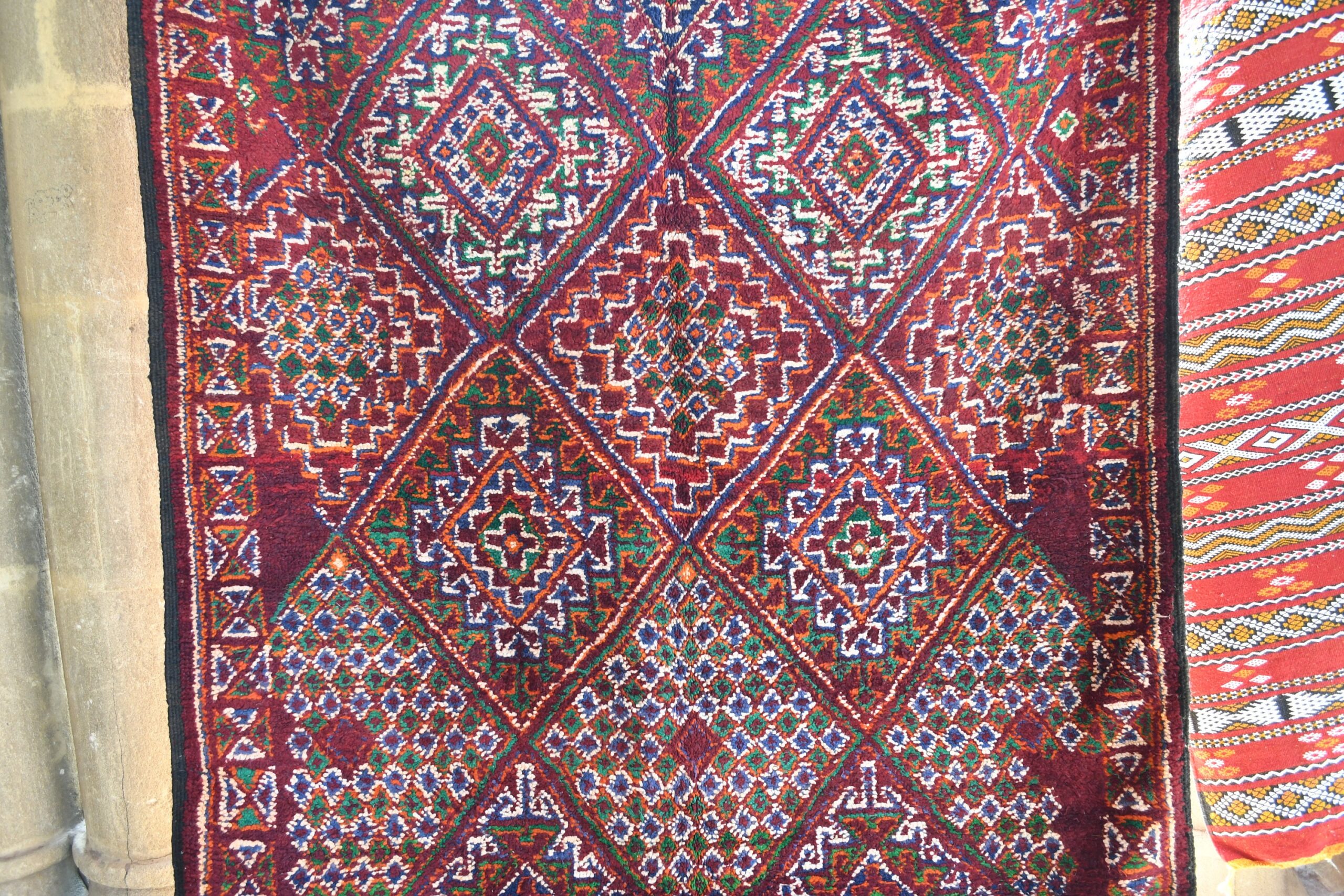 a red rug hanging on a wall. il_fullxfull.6076133135_85gs.jpg
