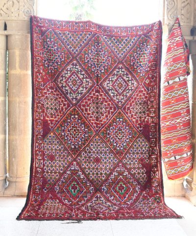 a red rug hanging on a wall. il_fullxfull.6076133525_abkz.jpg