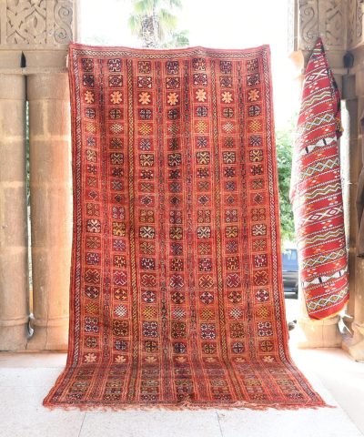 a red rug is on display in a room. il_fullxfull.6076136511_et52.jpg