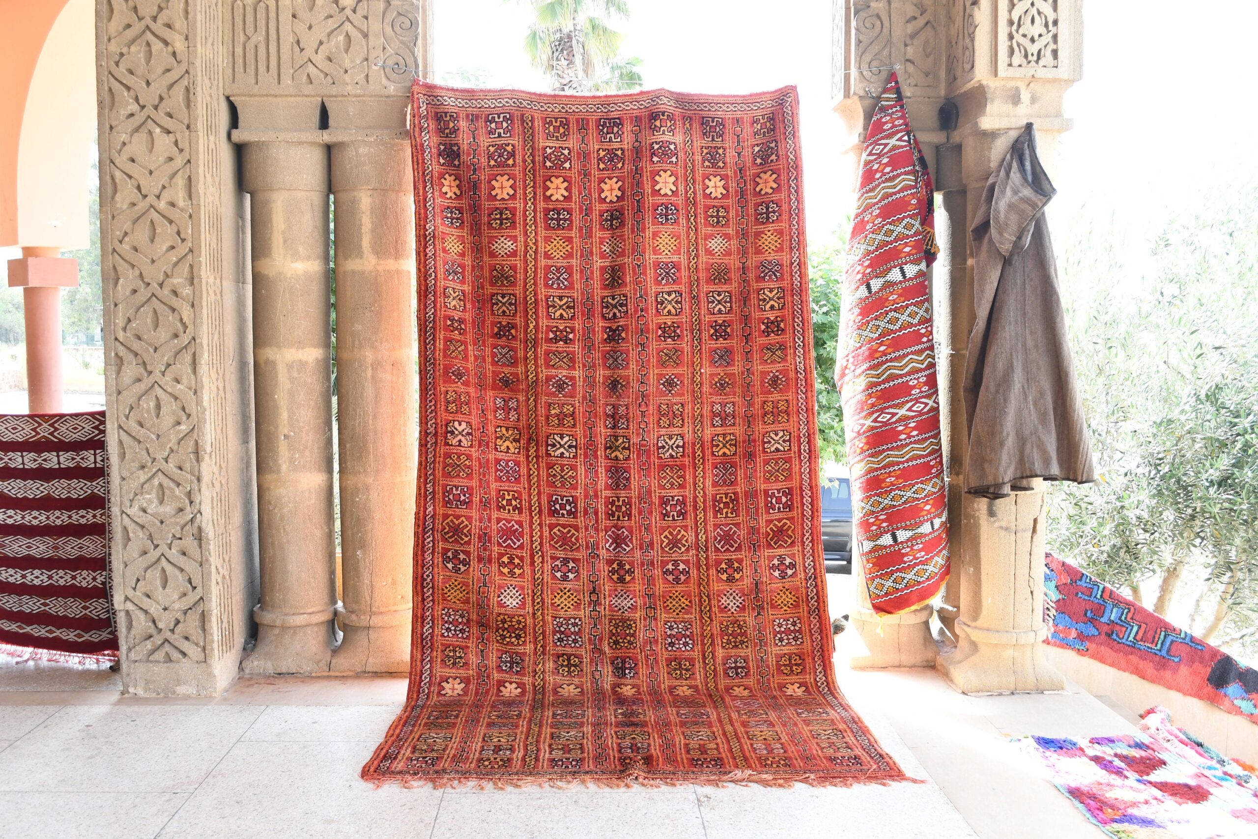 a red rug is on display in a room. il_fullxfull.6076136511_et52.jpg