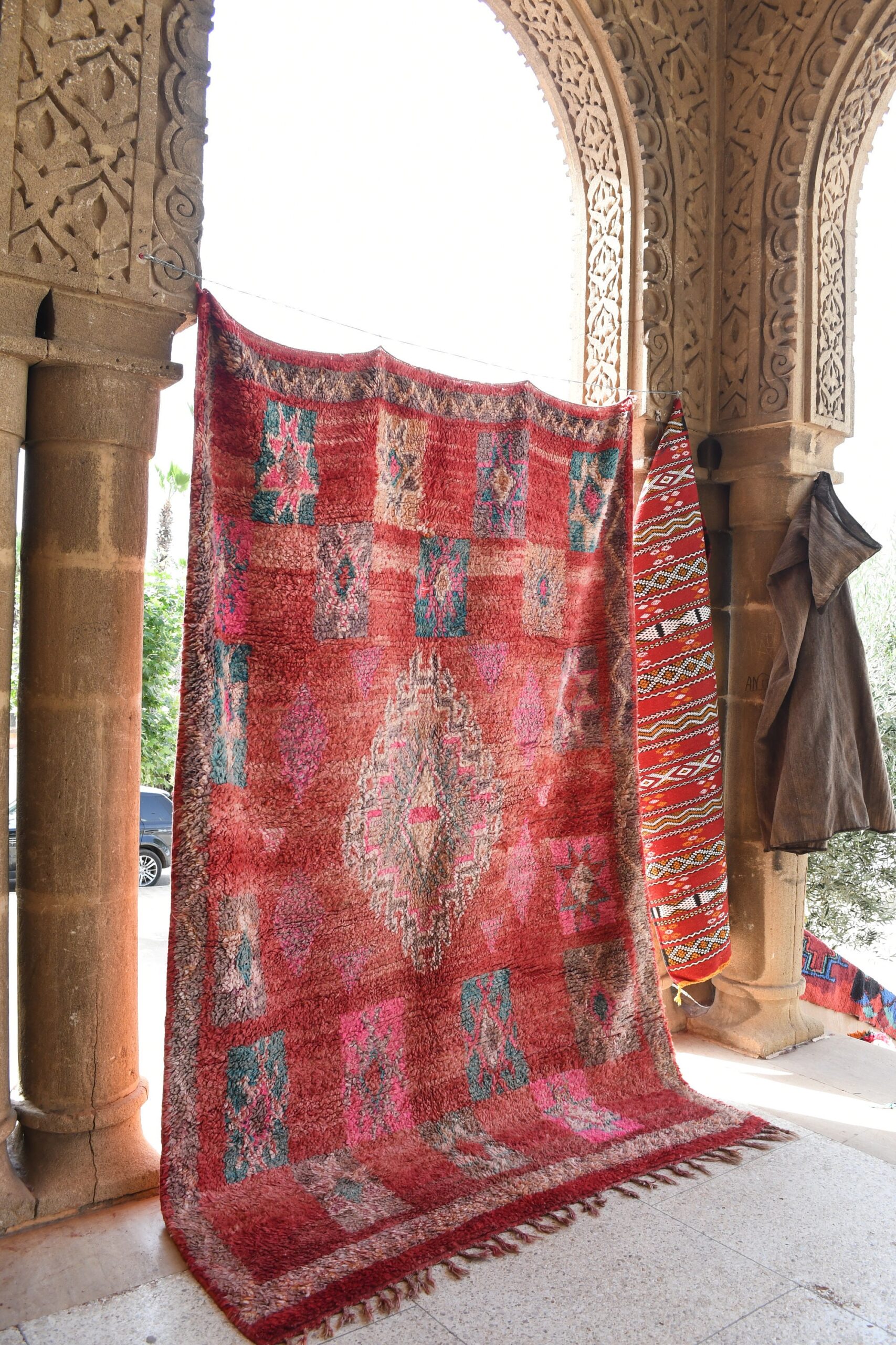 a red rug hanging on a wall. il_fullxfull.6076139111_4ydh.jpg