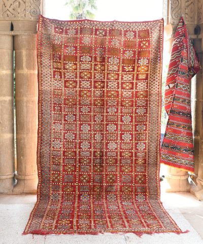 a red rug hanging on a wall. il_fullxfull.6076141123_8qop.jpg